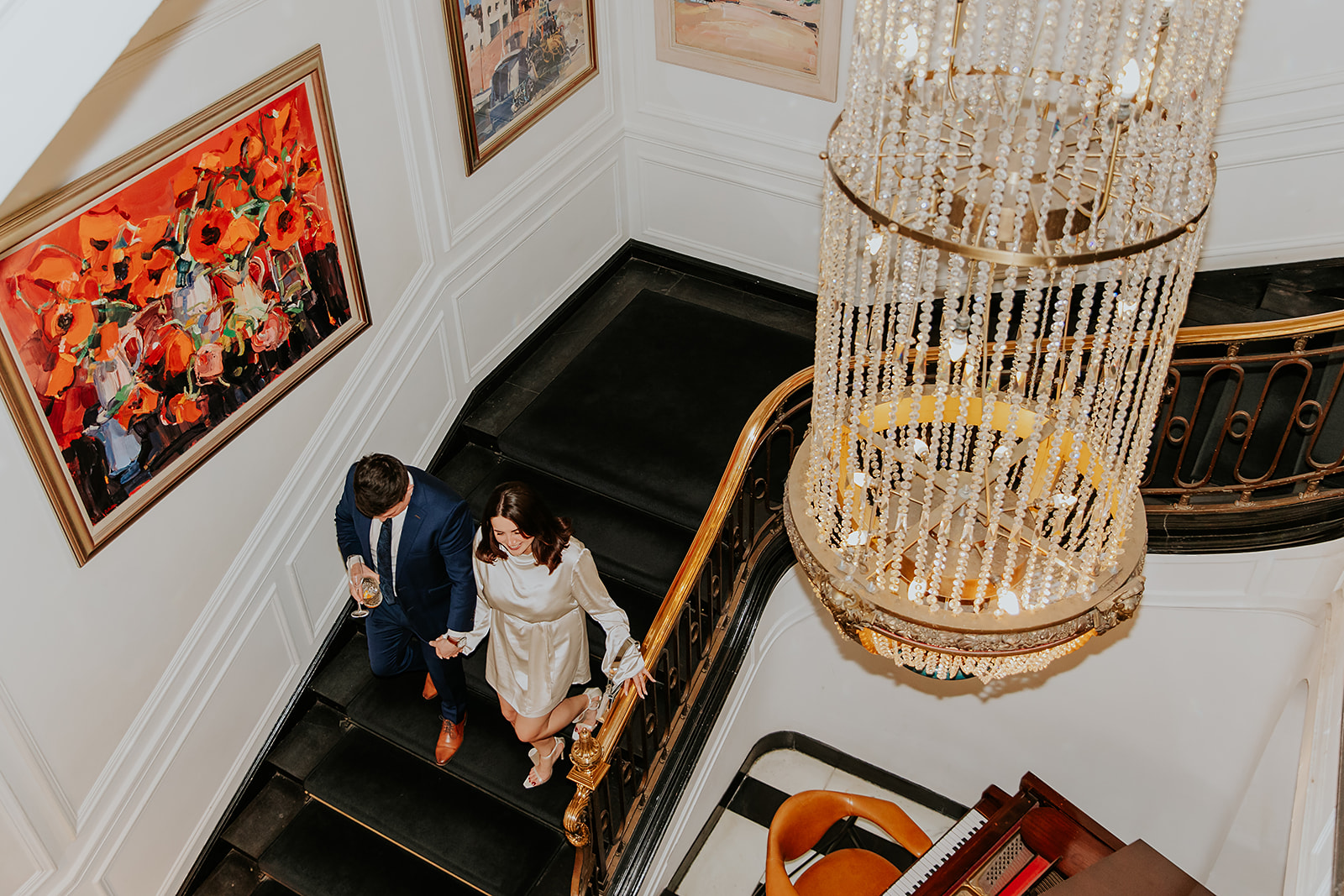 Bride and groom walking down stairs of Kimpton Blythswood Hotel Glasgow