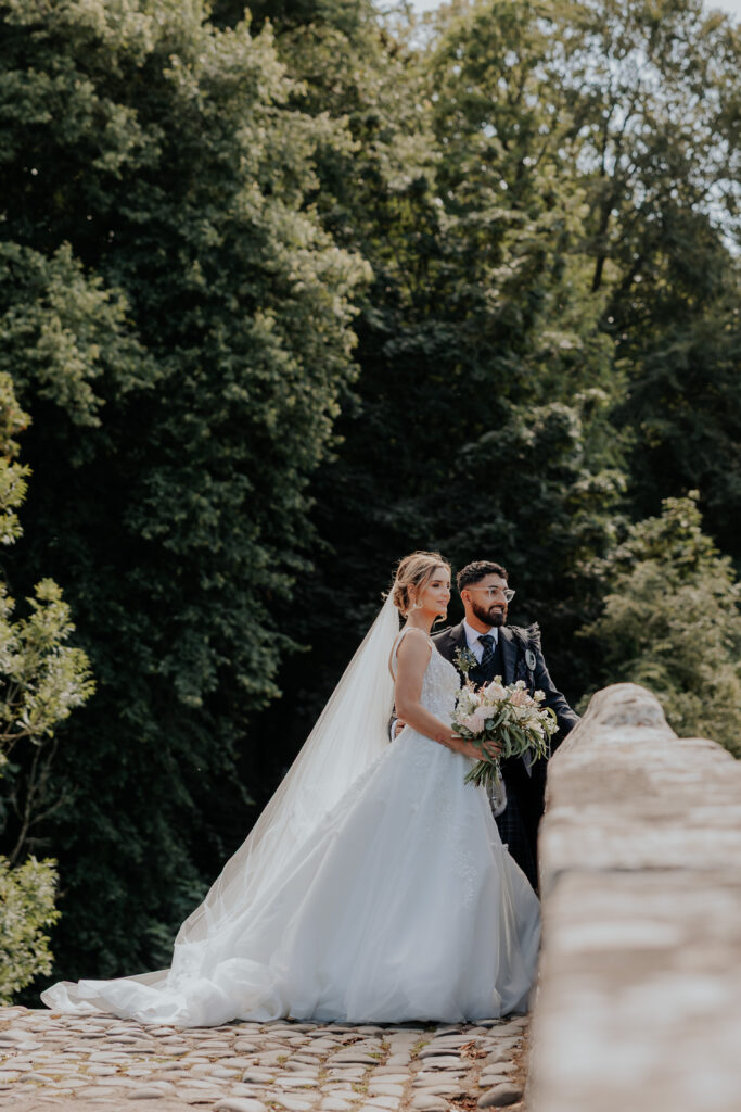 Couple standing on iconic brig o doon bridge
