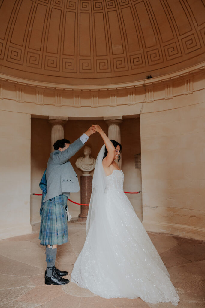 Newlyweds dancing at Burns Monument 